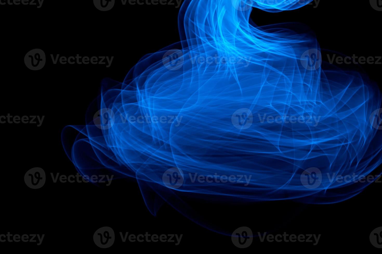 Glowing abstract curved blue lines photo