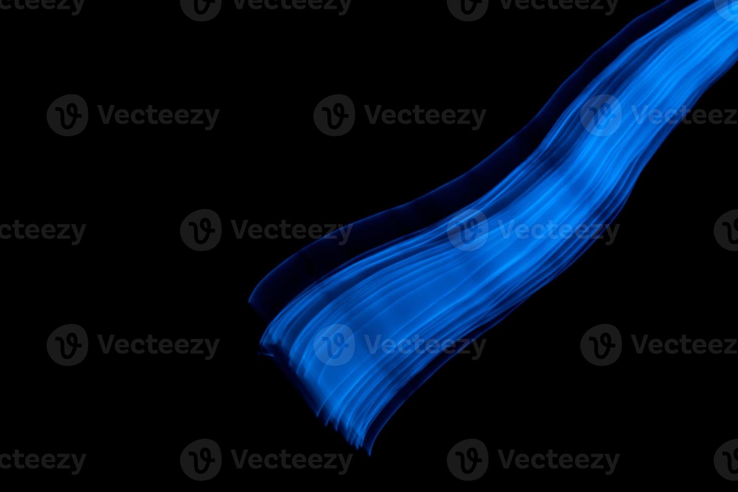 Glowing abstract curved blue lines photo