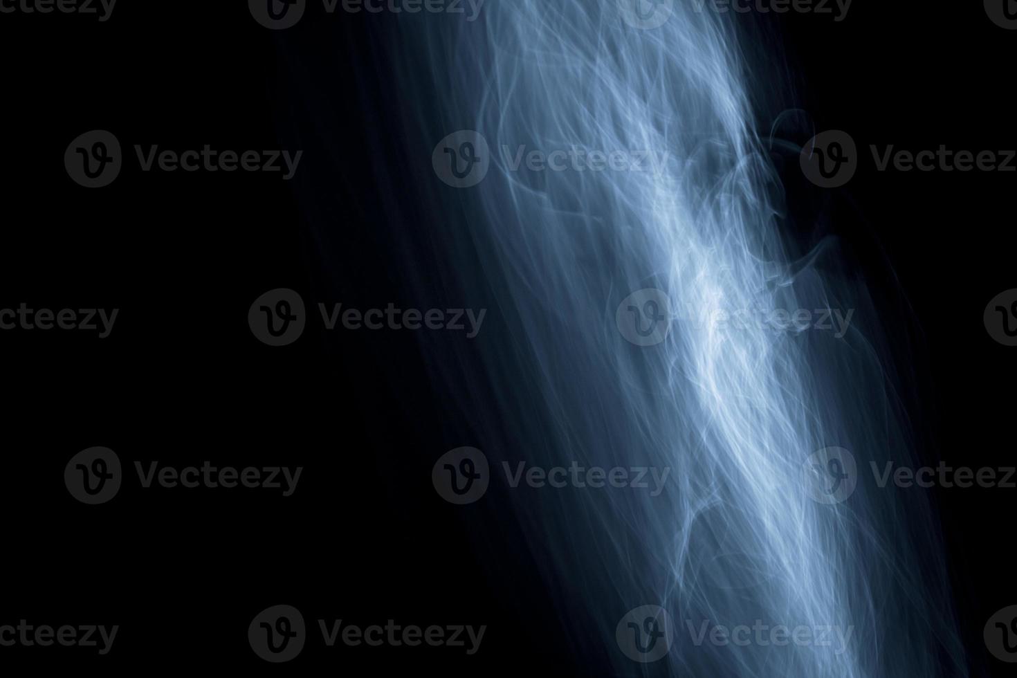 Glowing abstract curved light blue and white lines photo