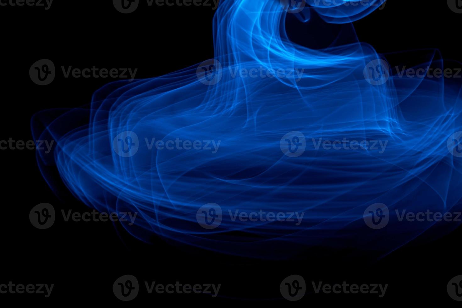 Glowing abstract curved blue lines photo