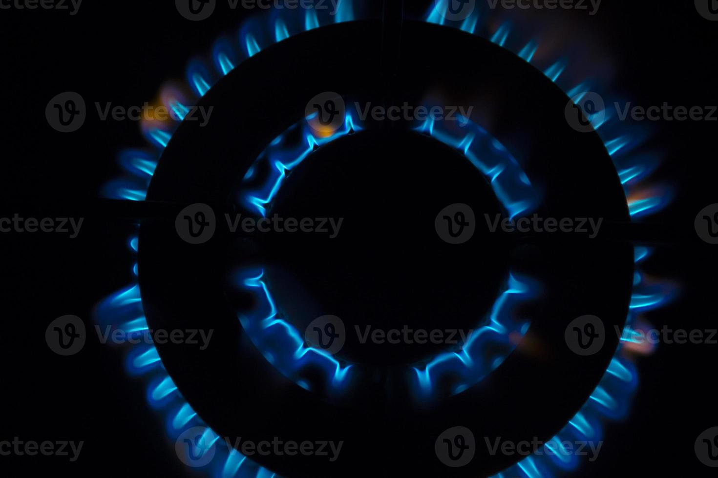 Gas burner flames - Closeup top view isolated on black background photo