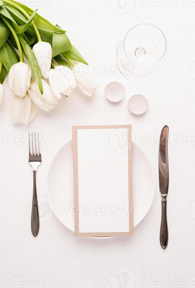 Mock up menu frame in restaurant or cafe. Top view of table setting photo