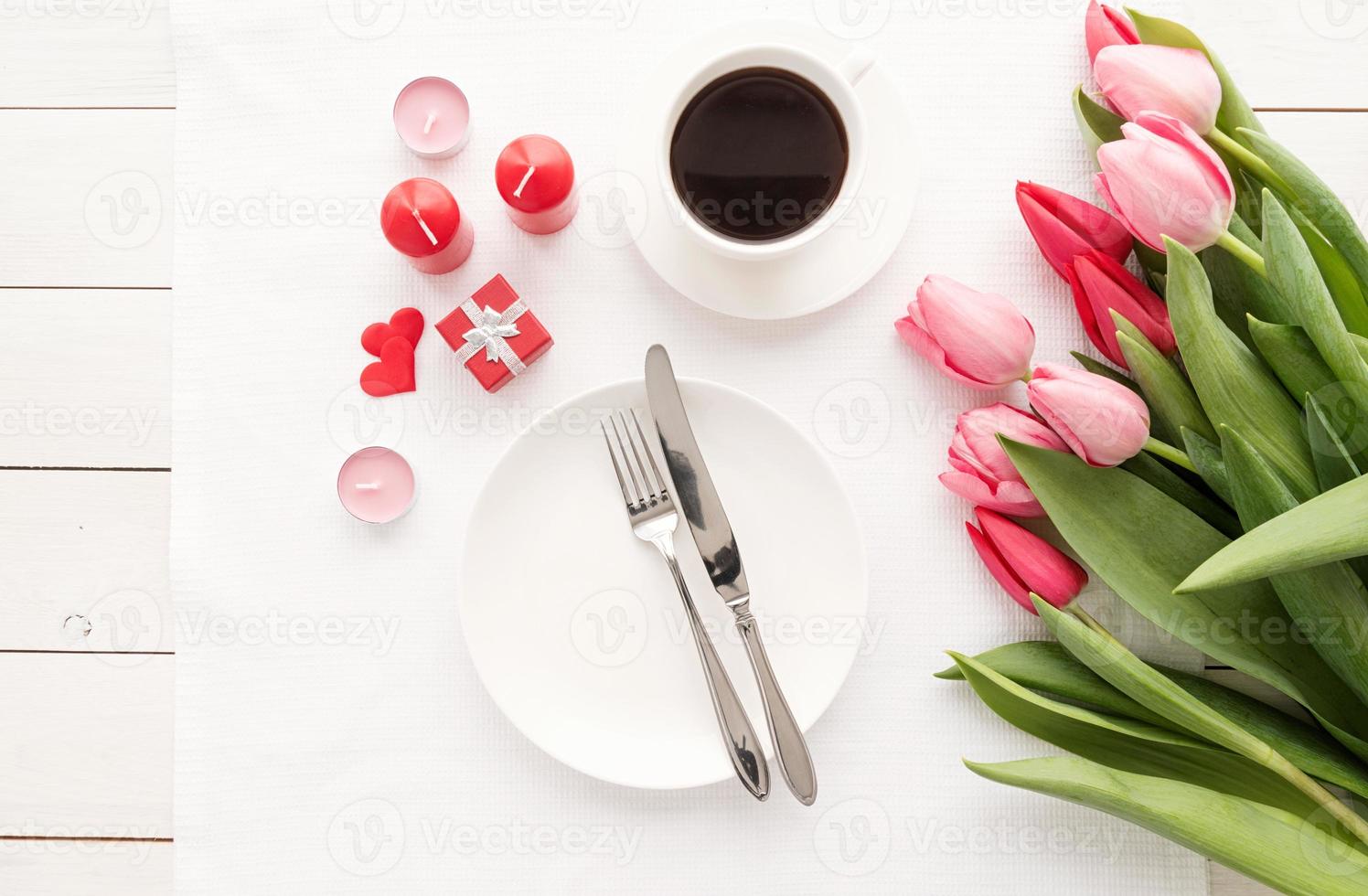 Elegant festive table setting with floral decor photo