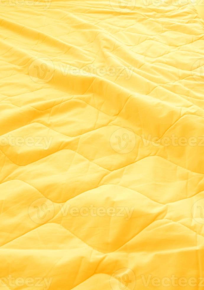 Blanket crumpled on the bed photo