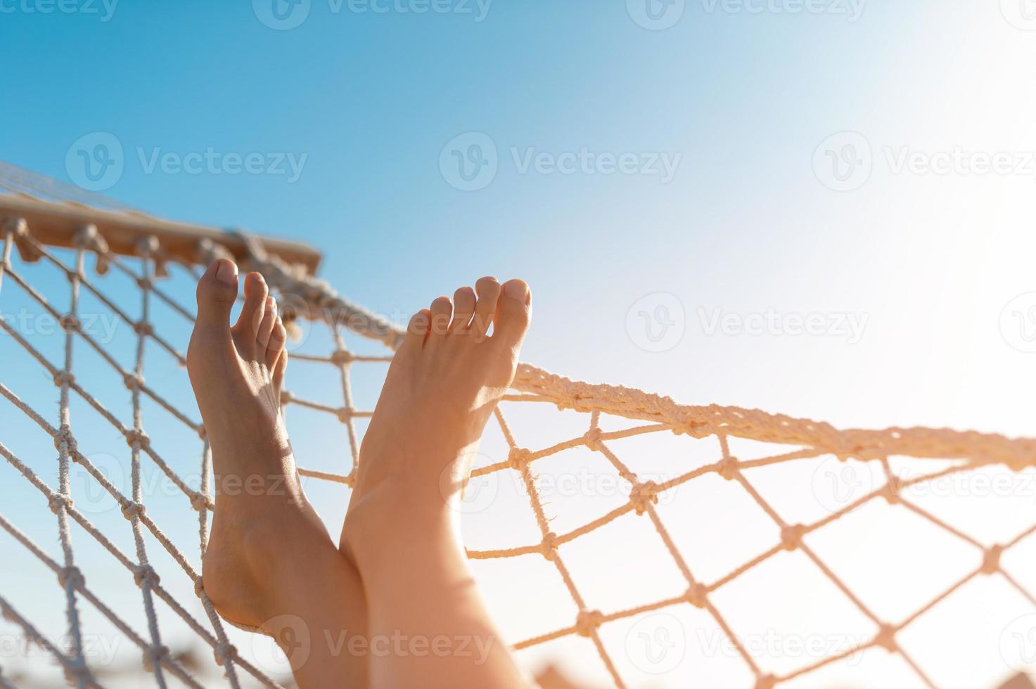 view of woman relaxing on hammock photo