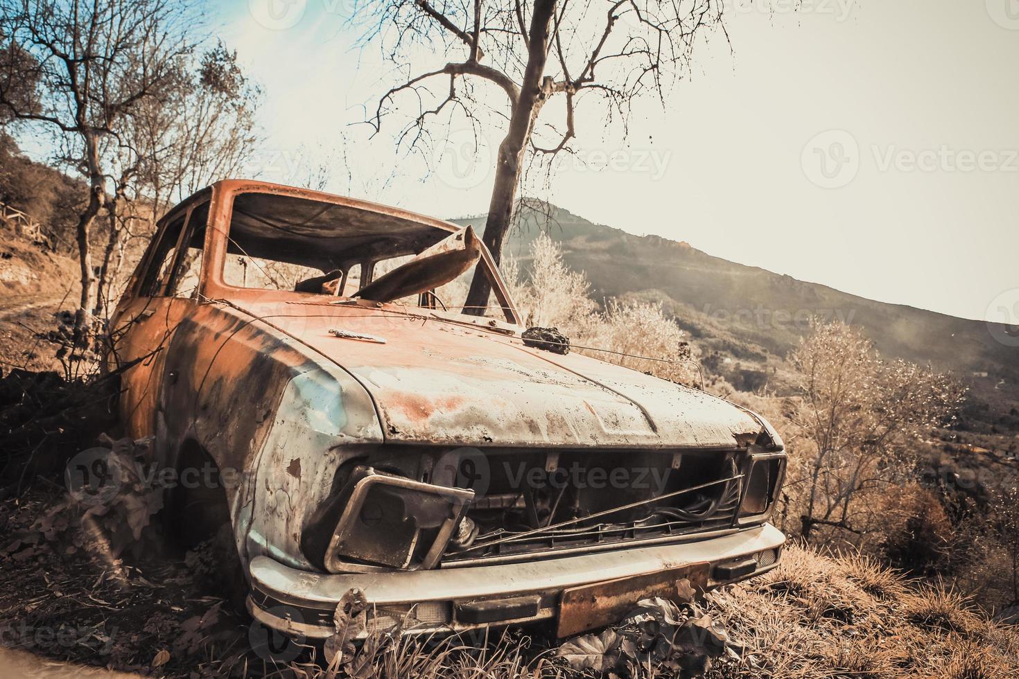 Old rusty and destroyed car photo