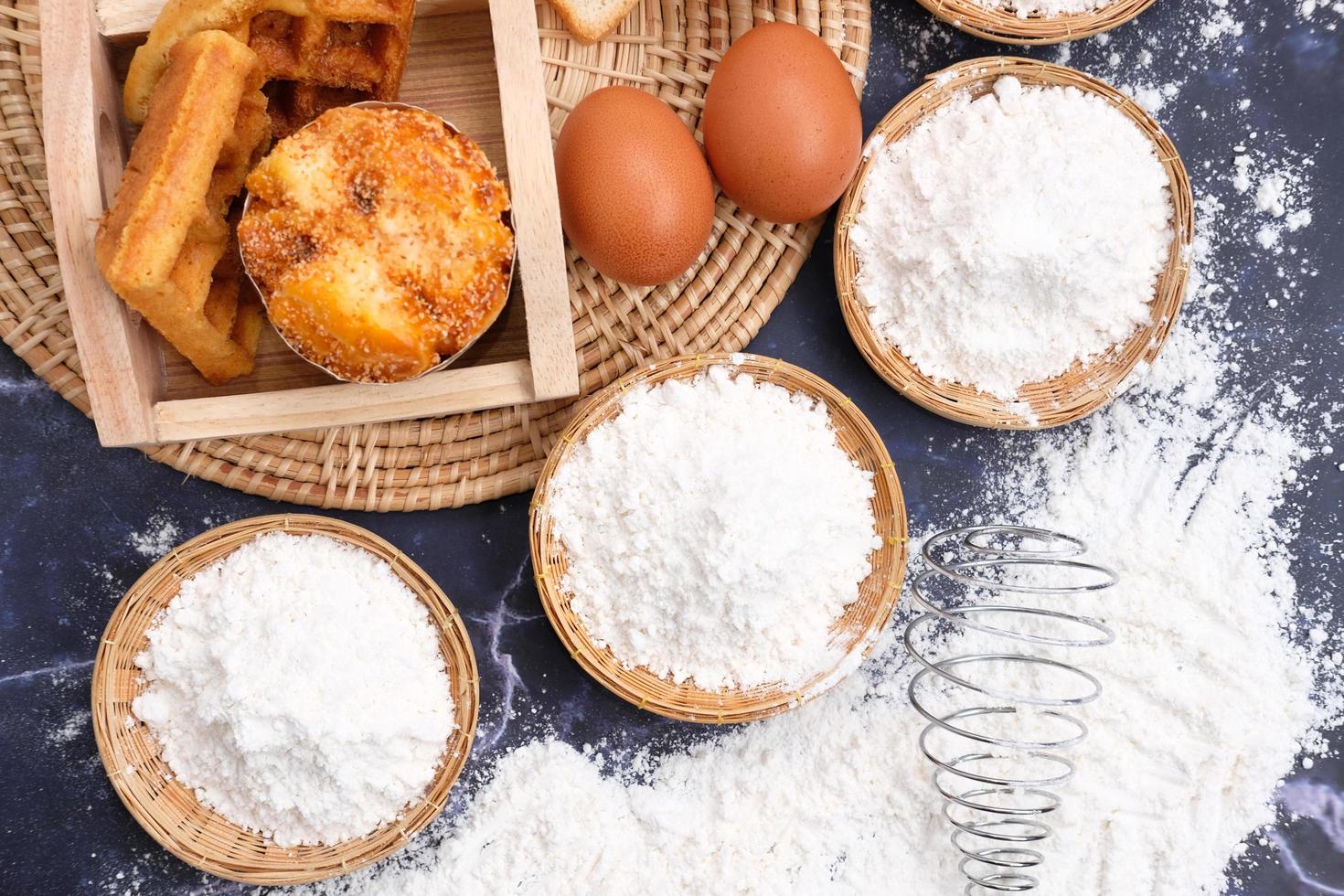 Flour and eggs for baking ingredients photo