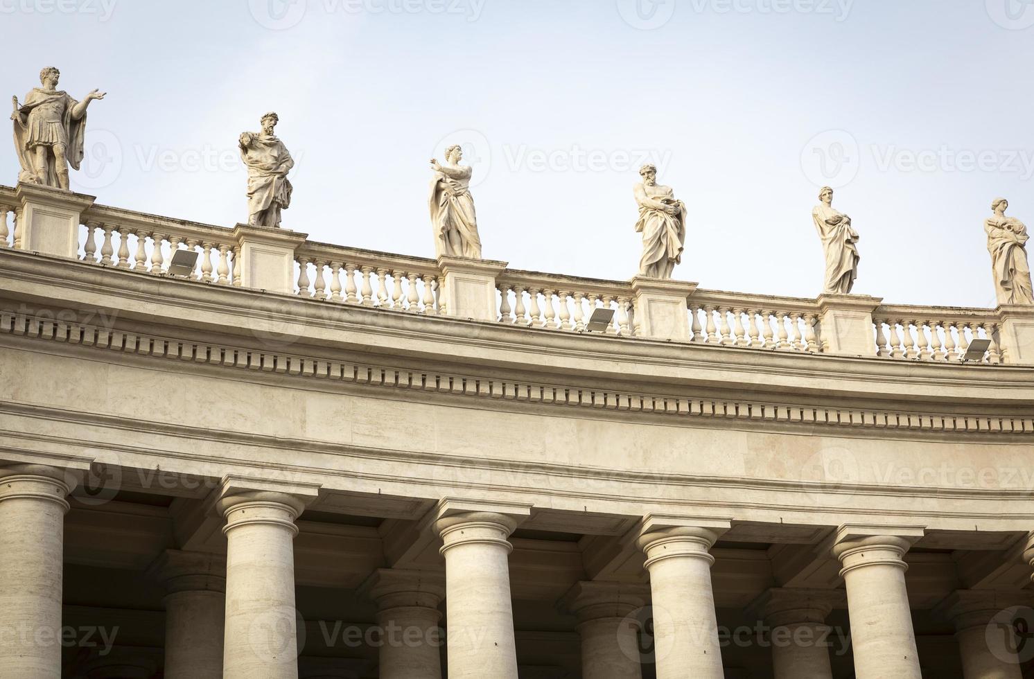 Marble sculptures of the popes on St. Peters Square in Vatican City photo