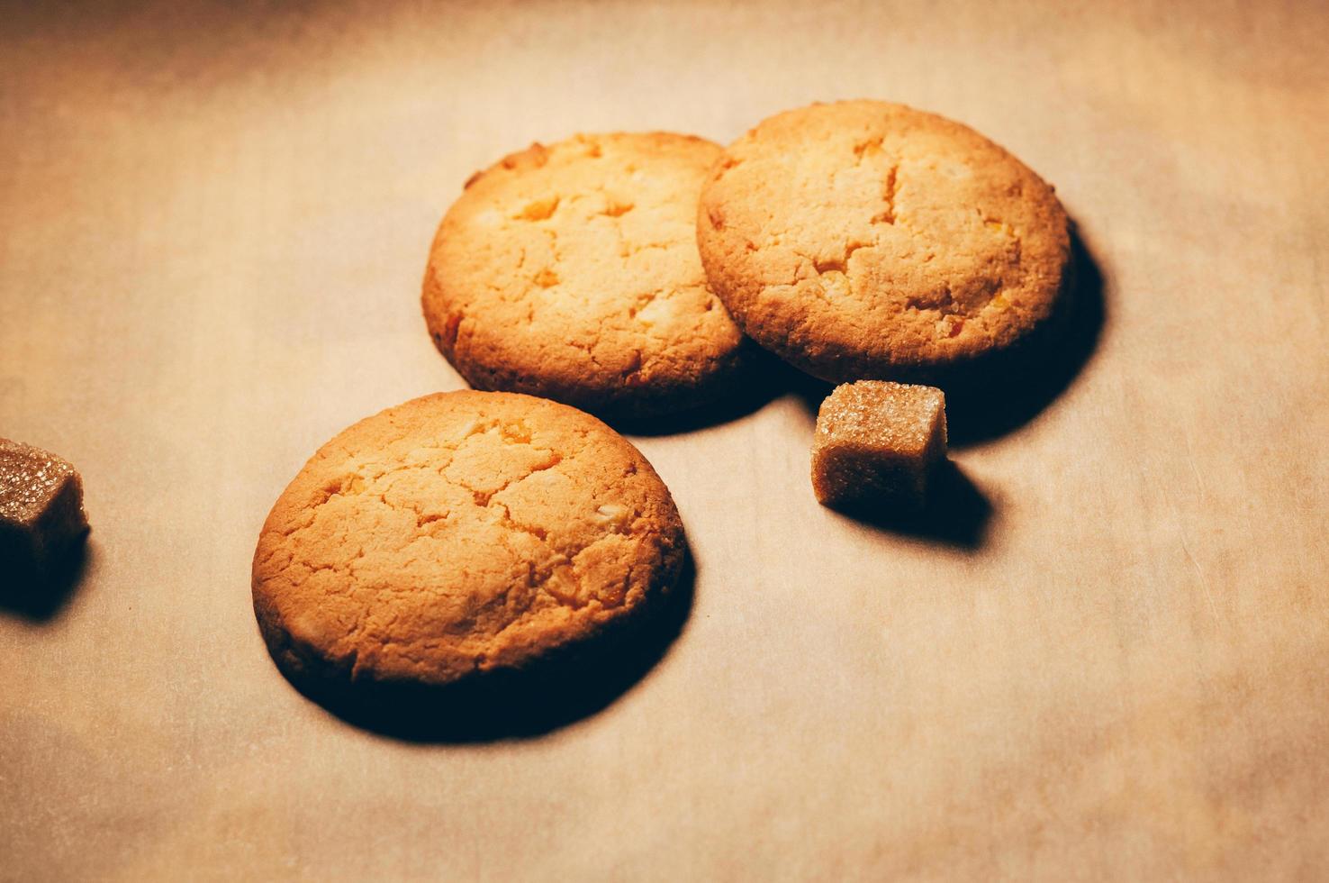 Biscuits with cane sugar cubes on the table photo