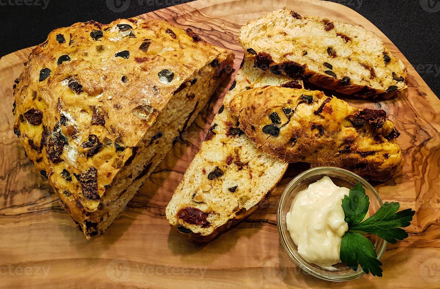 Homemade Mediterranean bread with pepper, olives and tomato photo