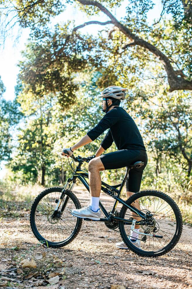 Mountain cyclists sitting on bicycles photo