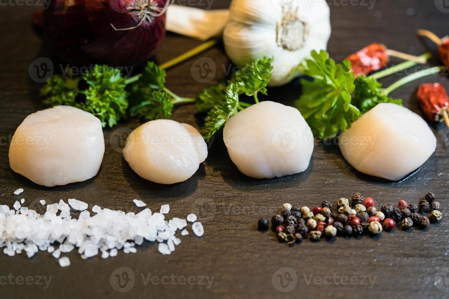 Scallops with red linguine pasta, herbs and spices photo