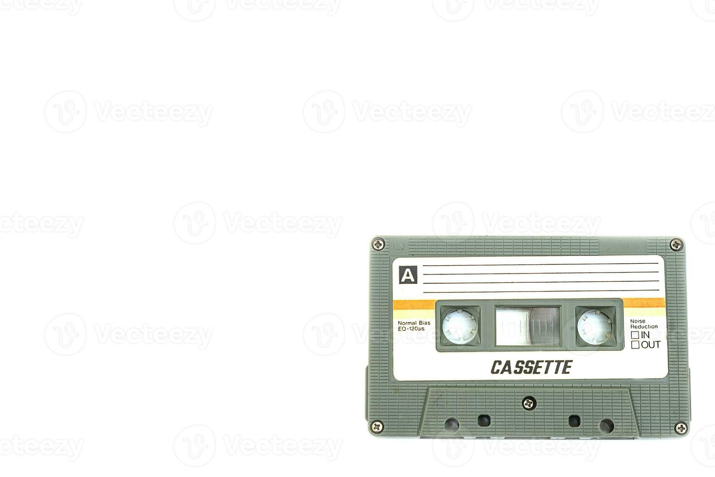 Vintage compact cassette tape on white background photo