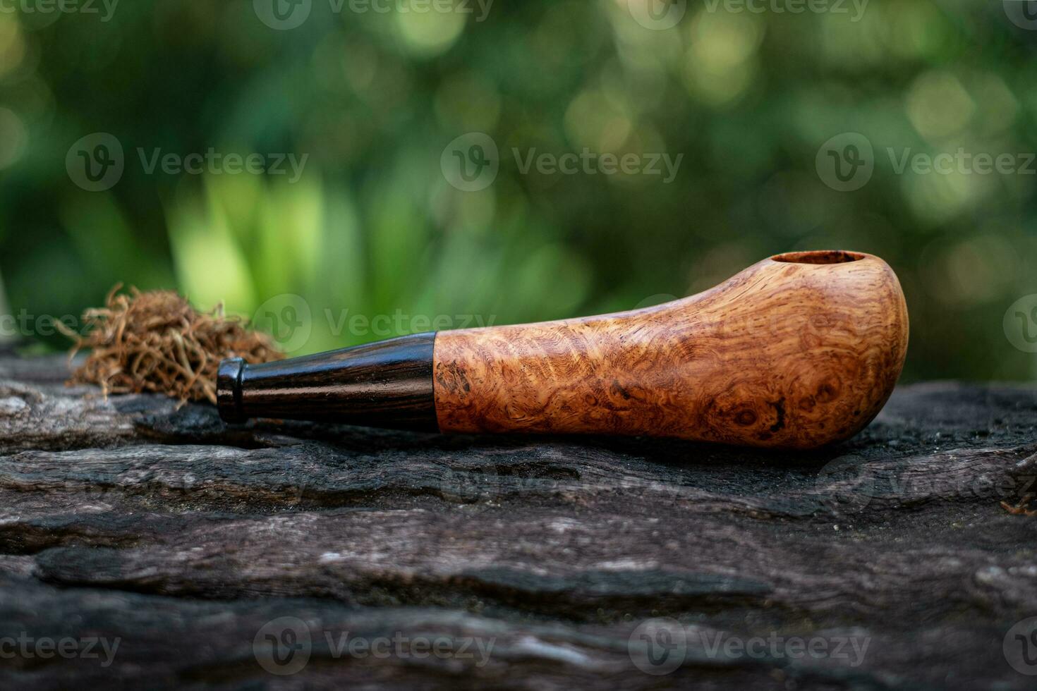 Tobacco pipe is made from burl wood photo