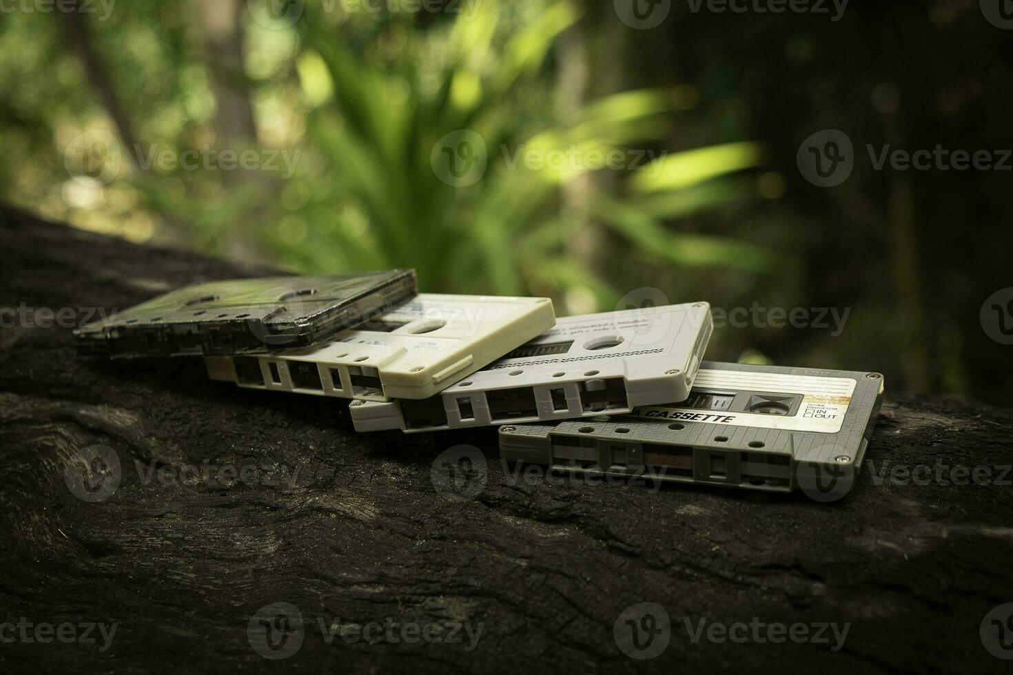 Compact cassette on table background photo