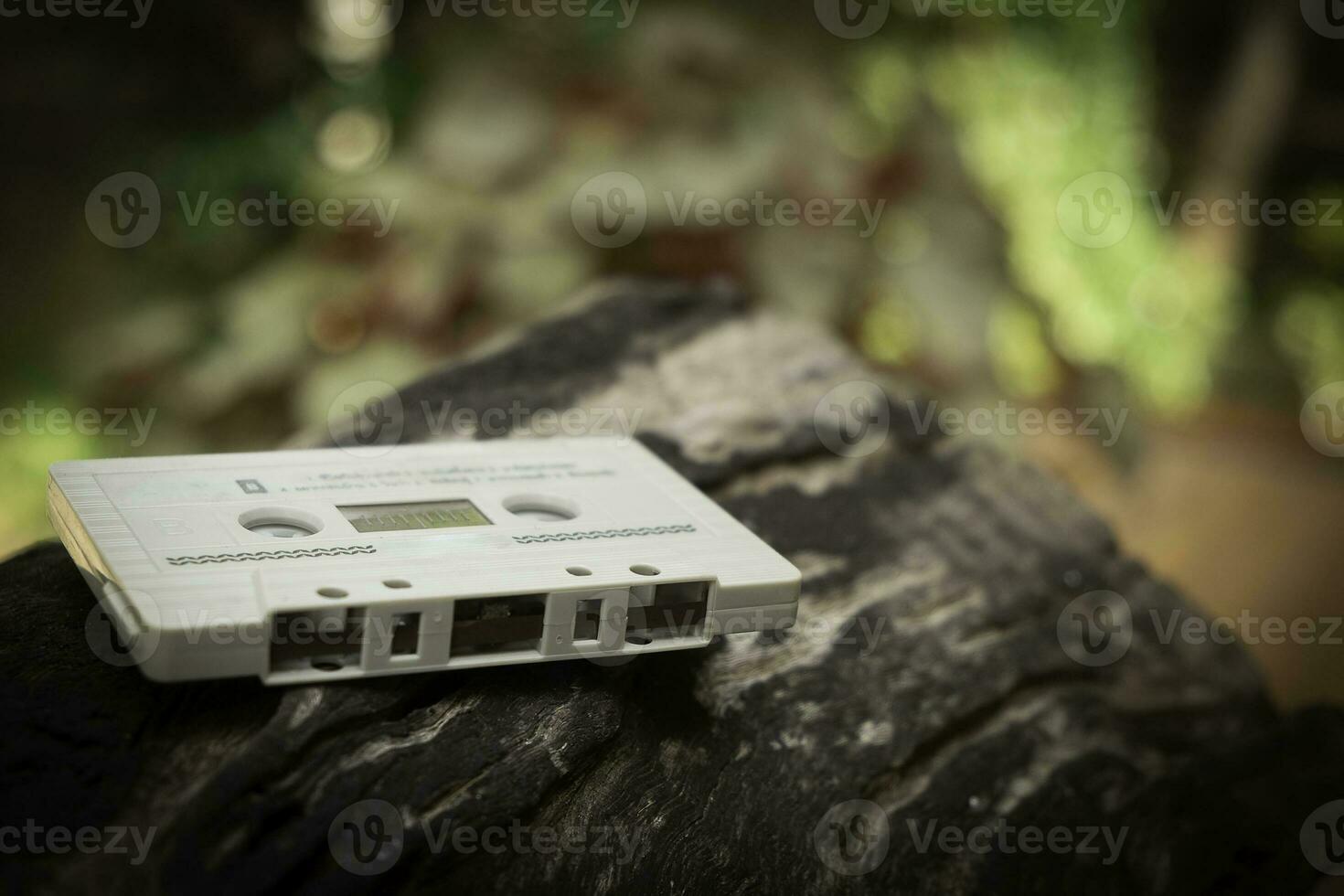 Compact cassette on table background photo