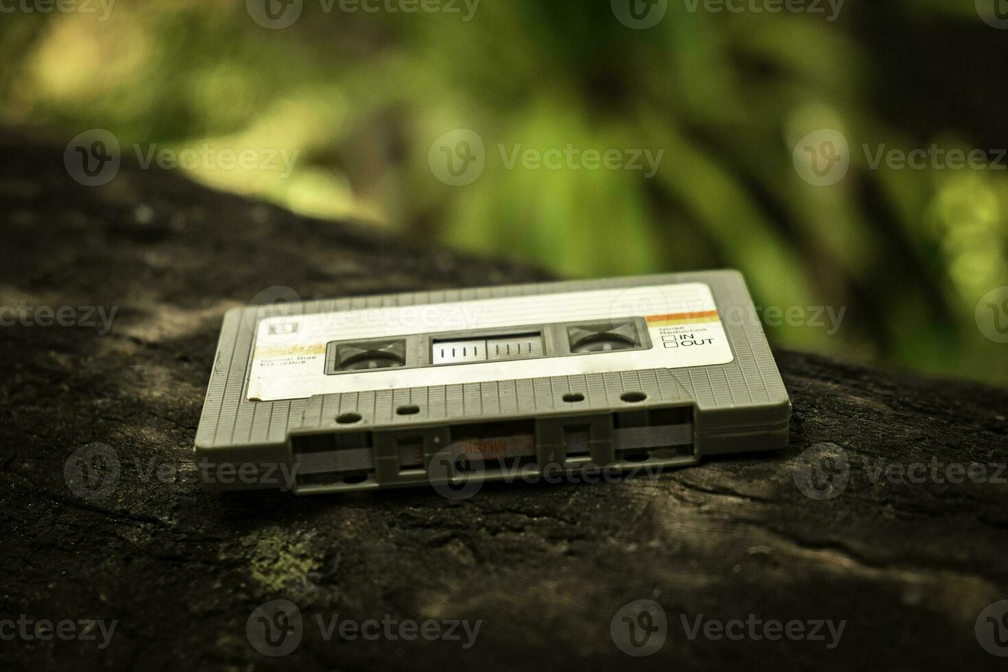 Compact cassette on table background photo