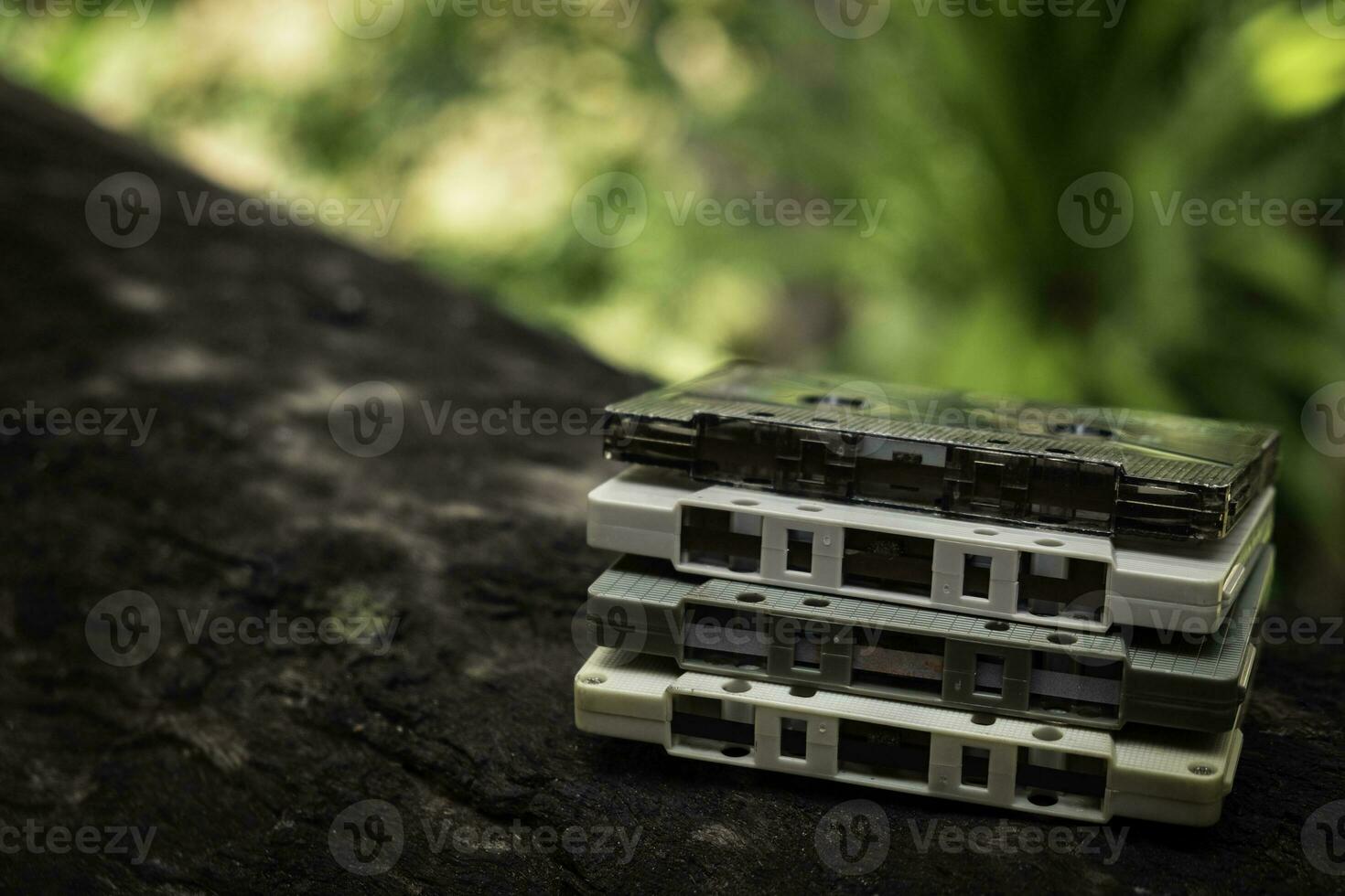 Compact cassette on table background photo