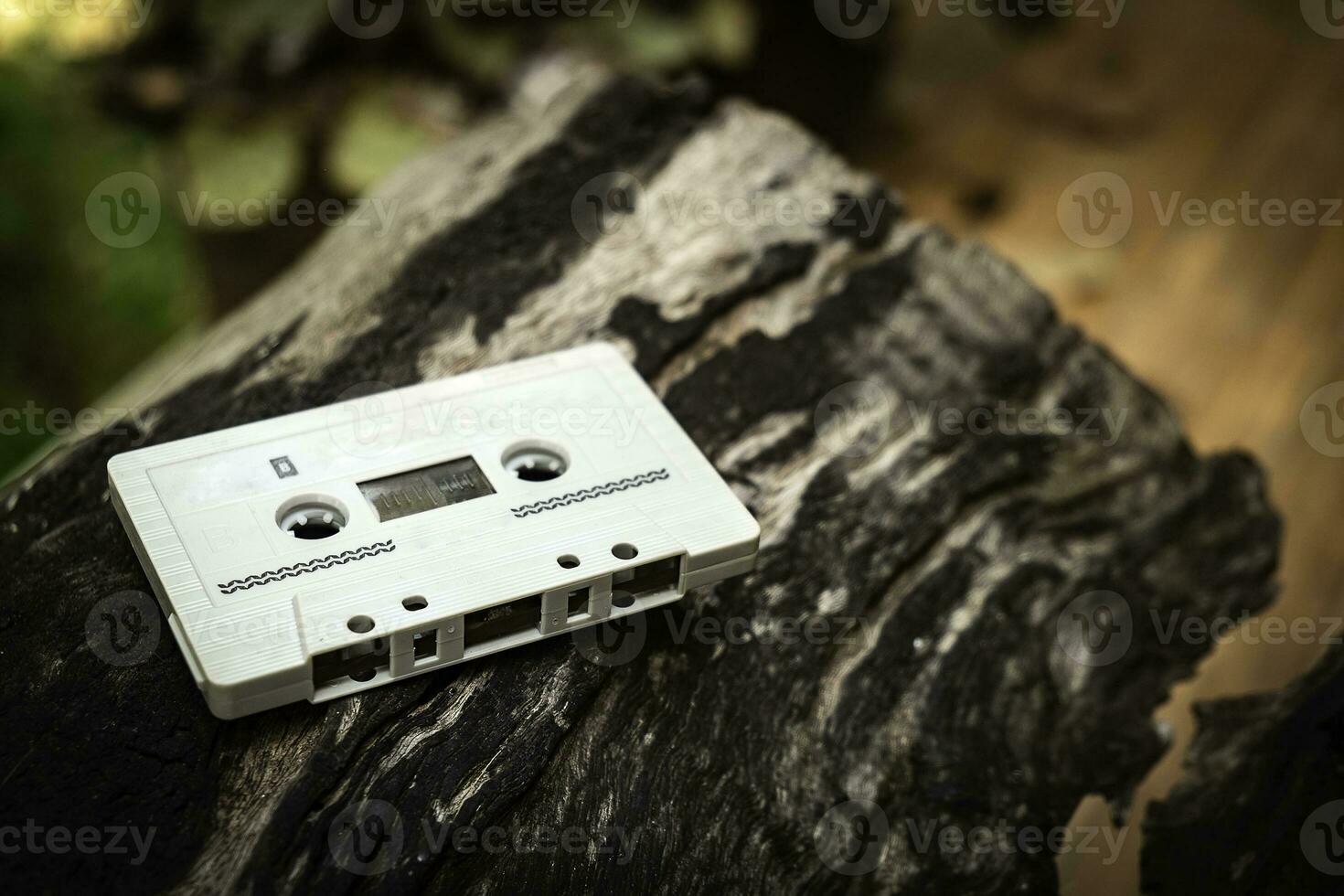 Compact cassette on table background photo