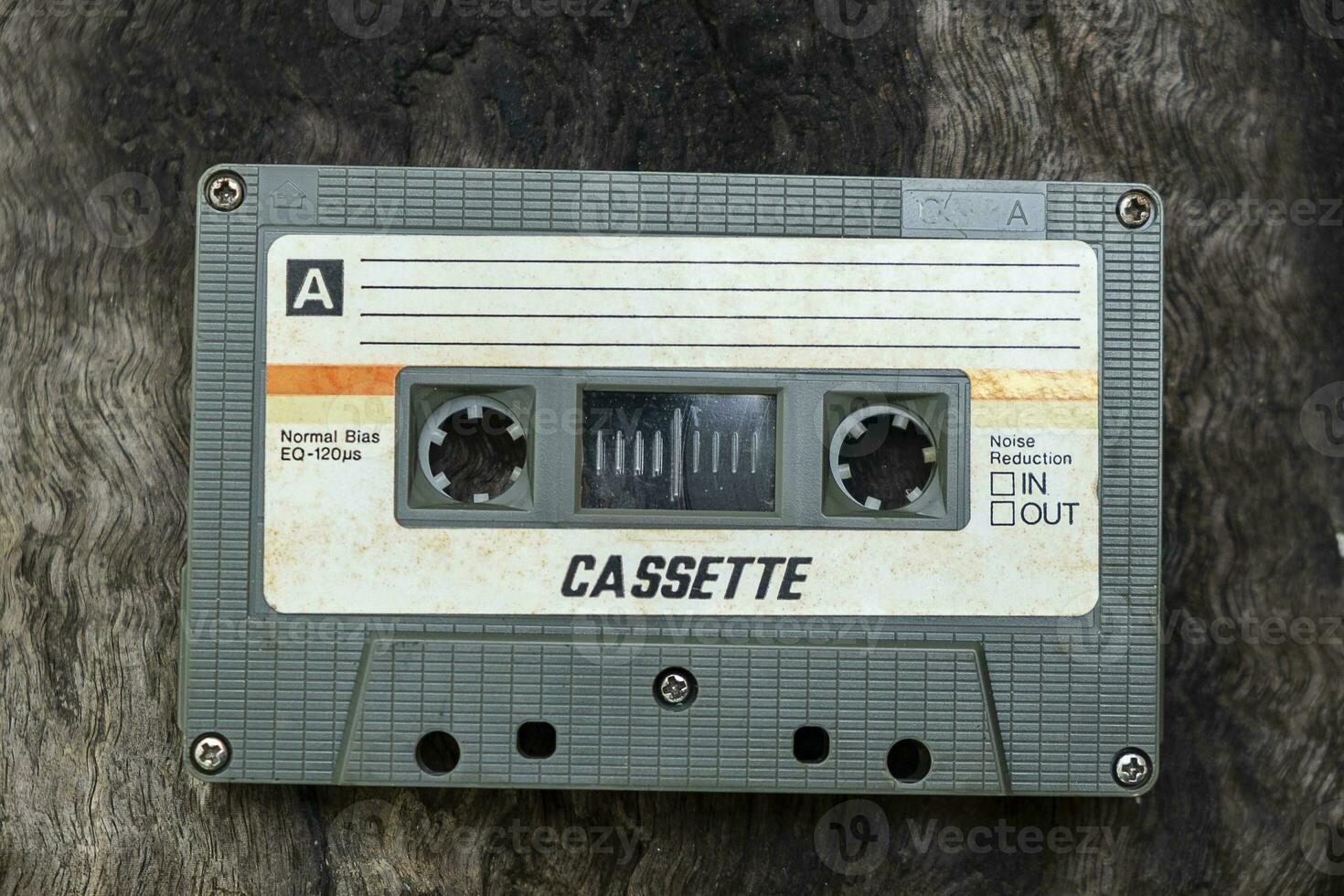 Compact cassette on table background photo