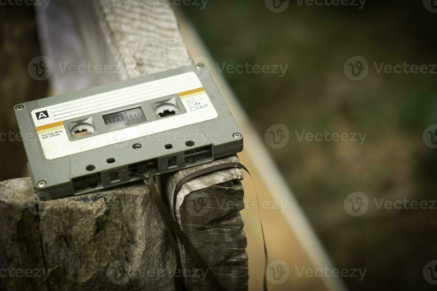 Compact cassette on table background photo