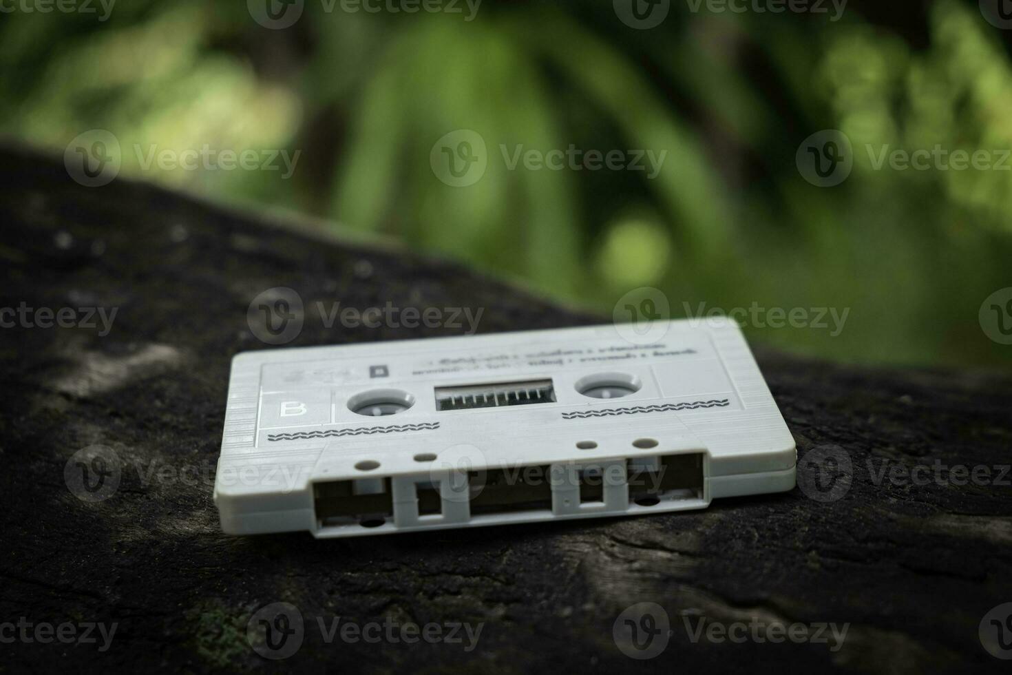 Compact cassette on table background photo