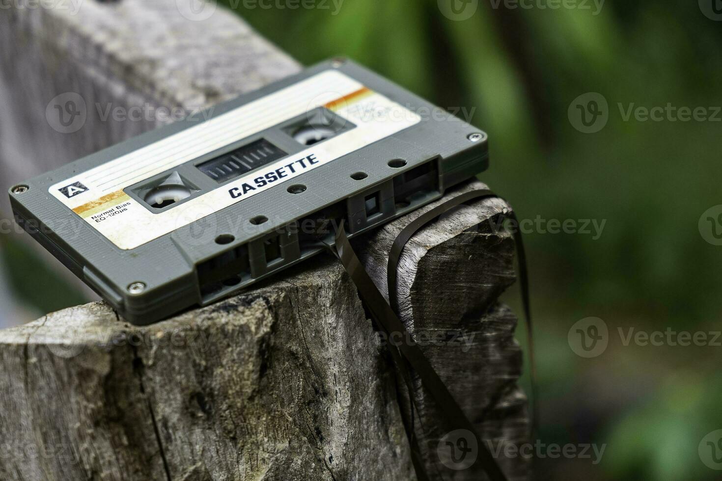 Compact cassette on table background photo