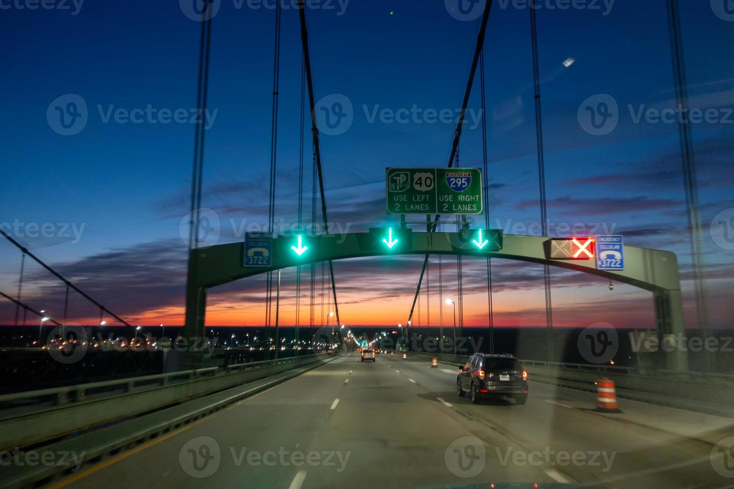 driving over a bridge early morning at sunriseac photo