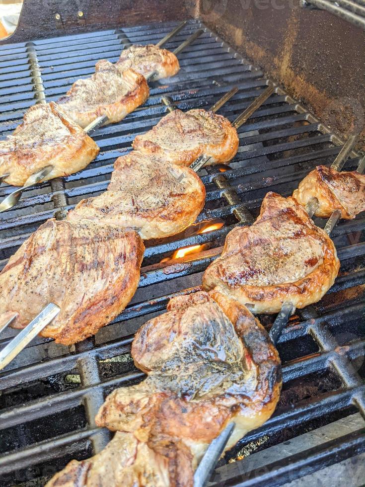 picanha steak on skewers for grilling photo