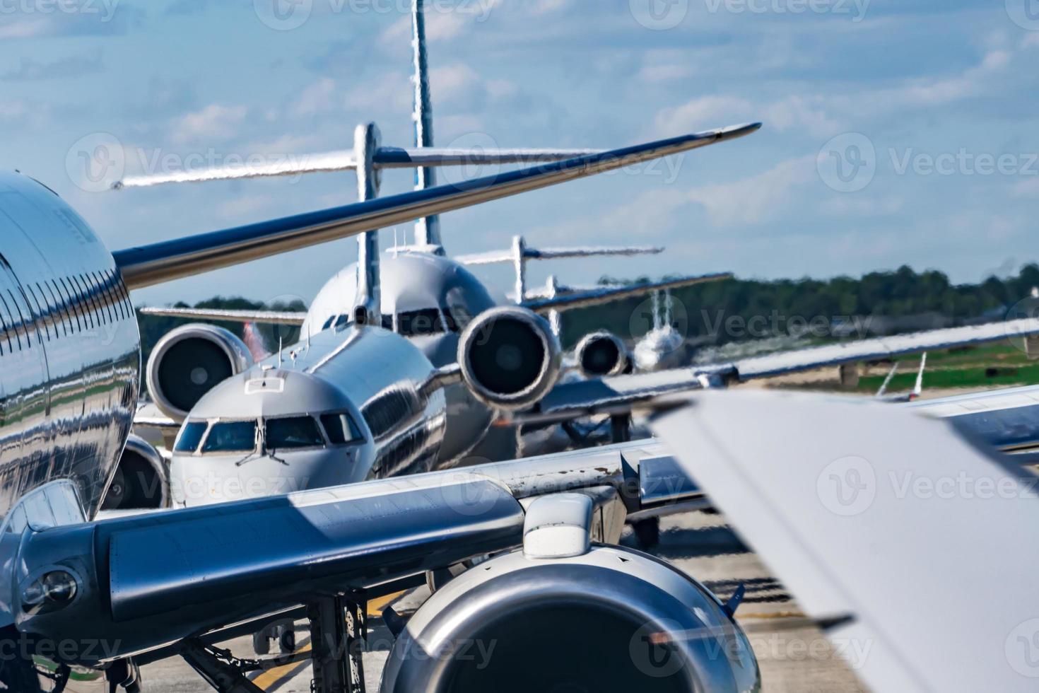 busy airport tarmac traffic before airplanes take off photo