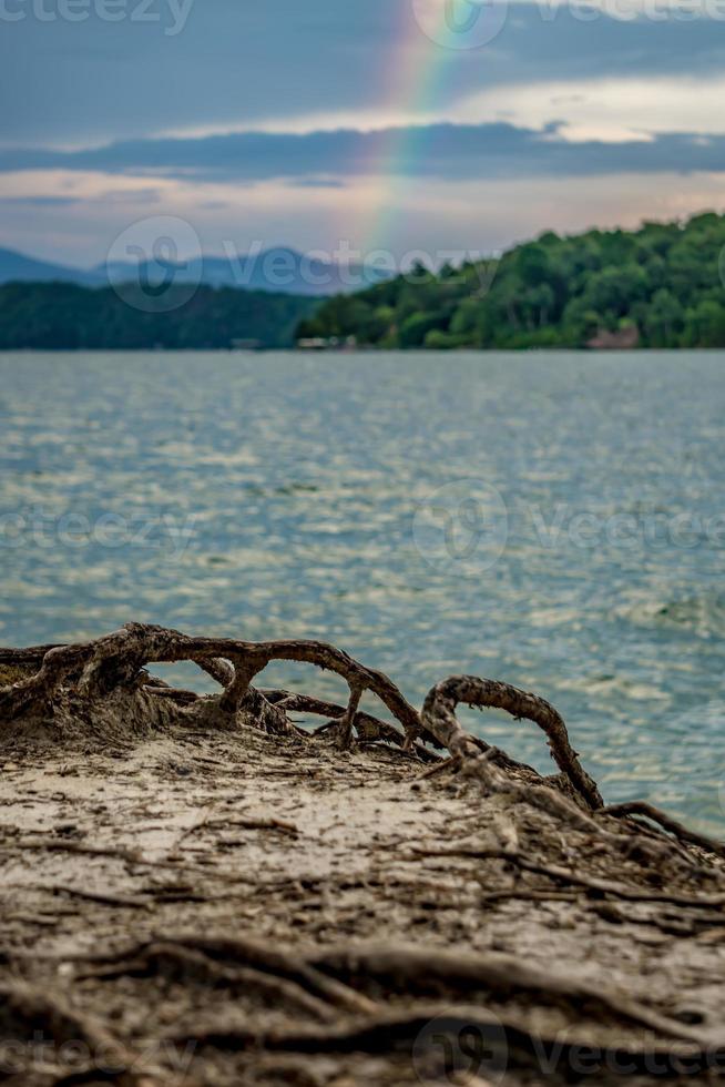 rainbow after thunderstorm at lake jocassee south carolina photo