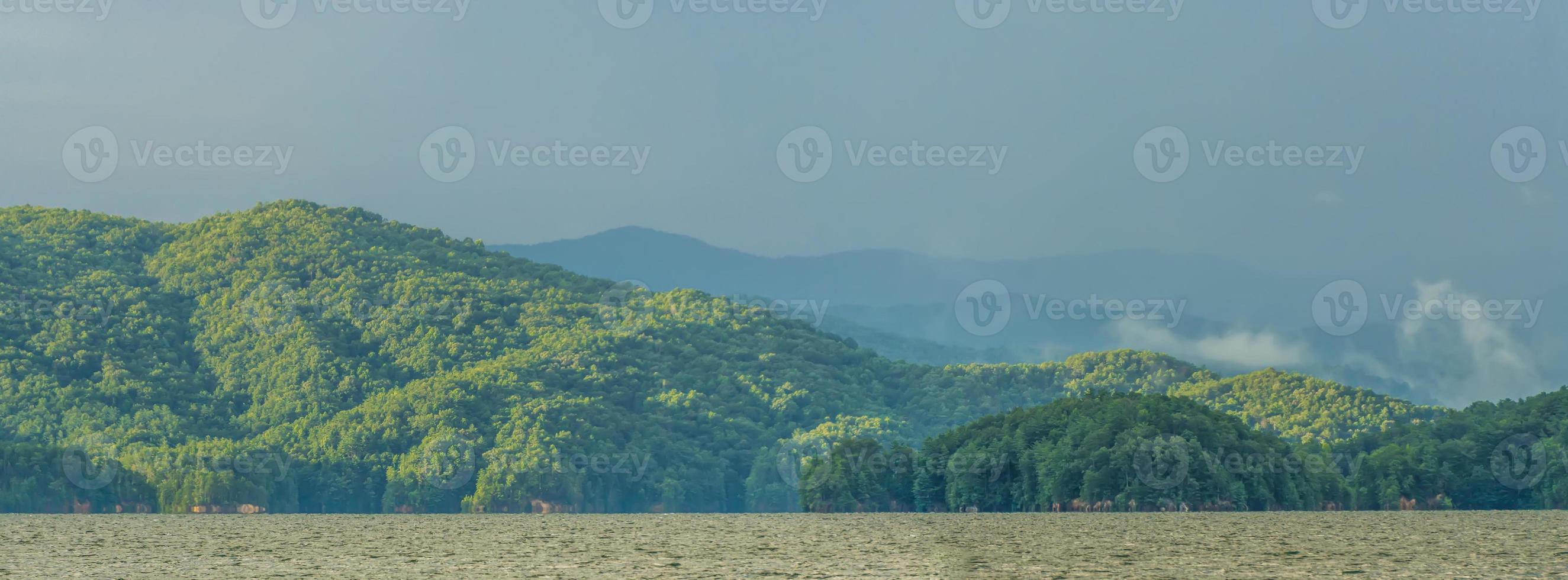 rainbow after thunderstorm at lake jocassee south carolina photo