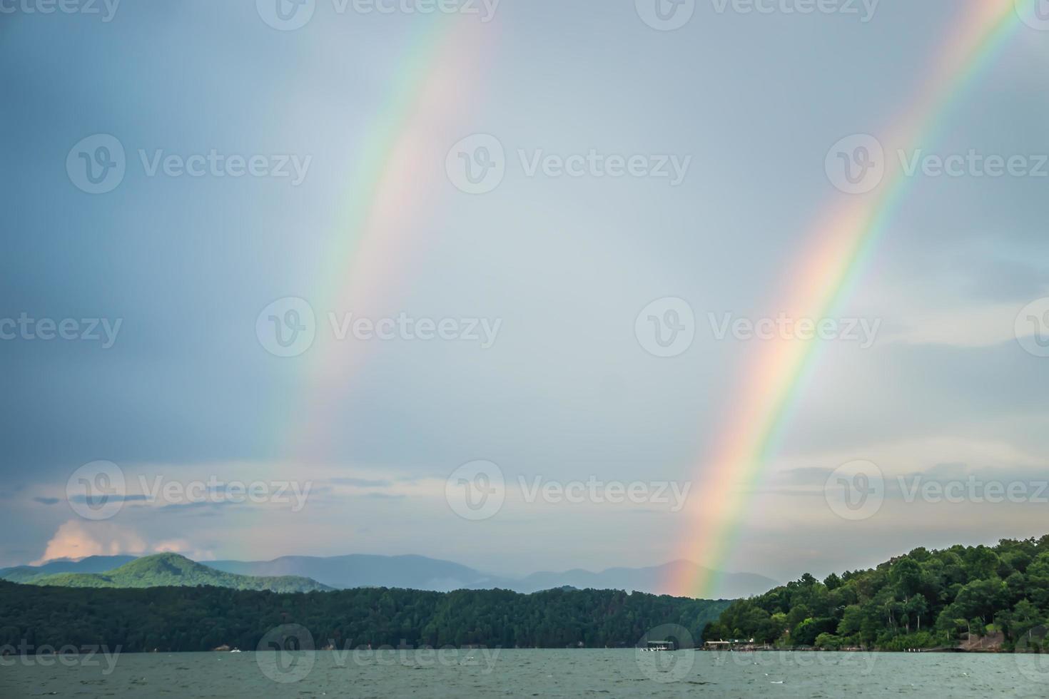 rainbow after thunderstorm at lake jocassee south carolina photo