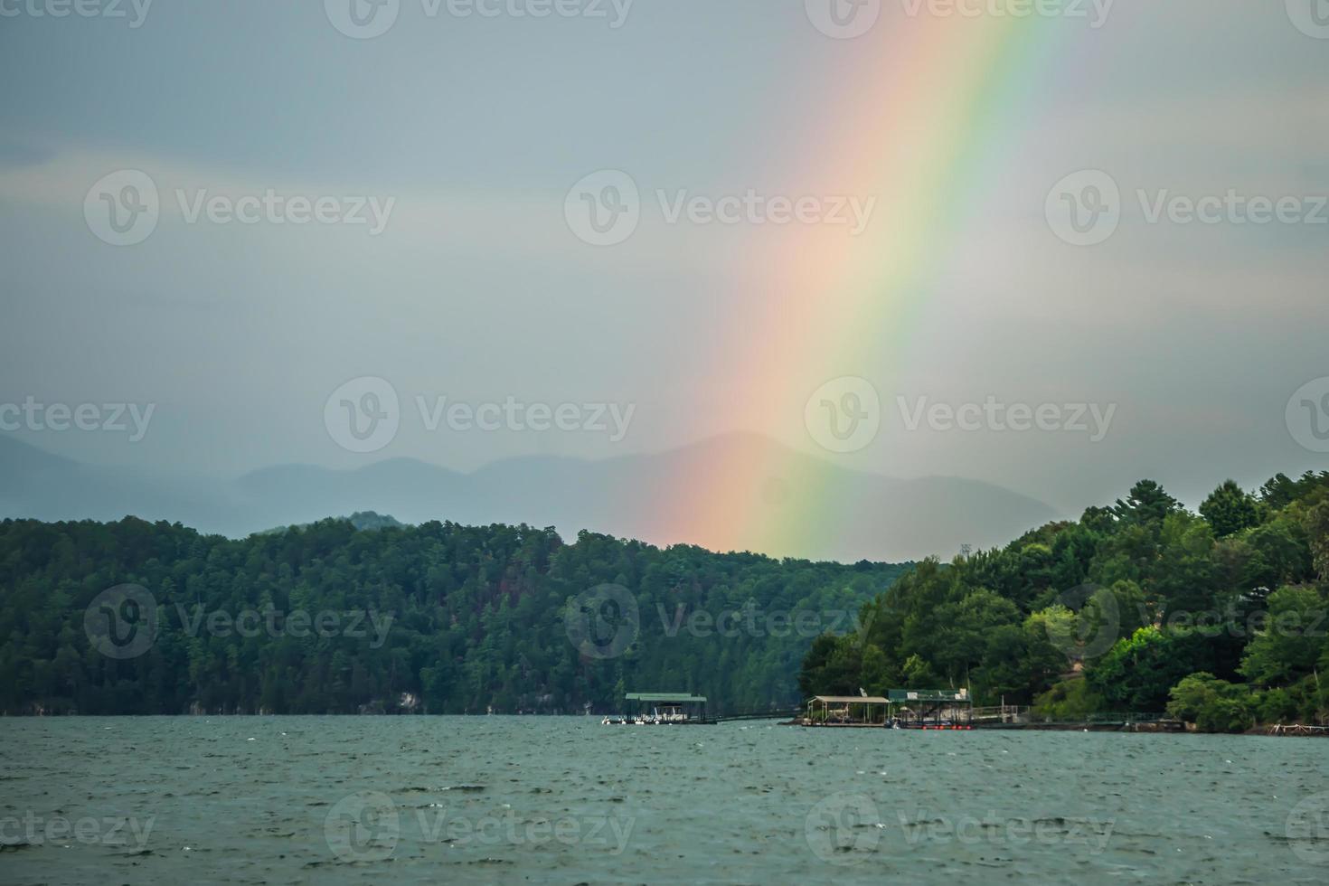 rainbow after thunderstorm at lake jocassee south carolina photo