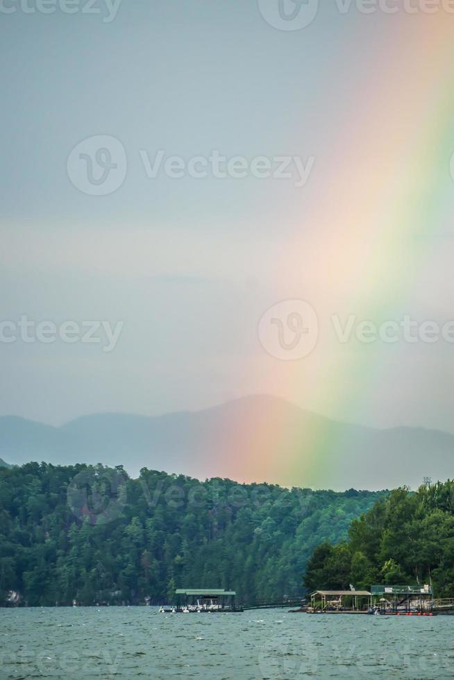 rainbow after thunderstorm at lake jocassee south carolina photo