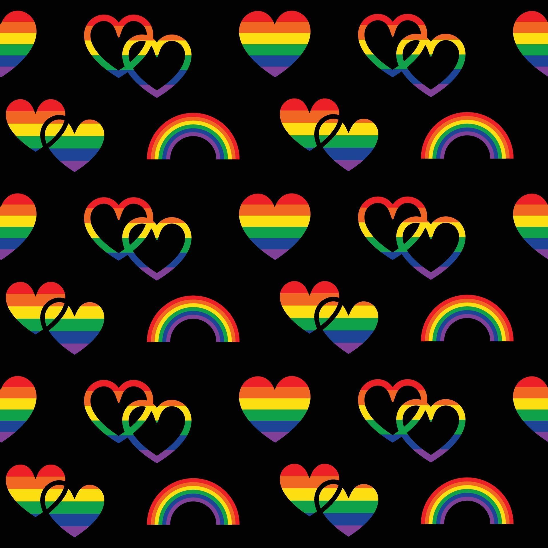 rainbow pride seamless pattern with hearts and rainbows on black