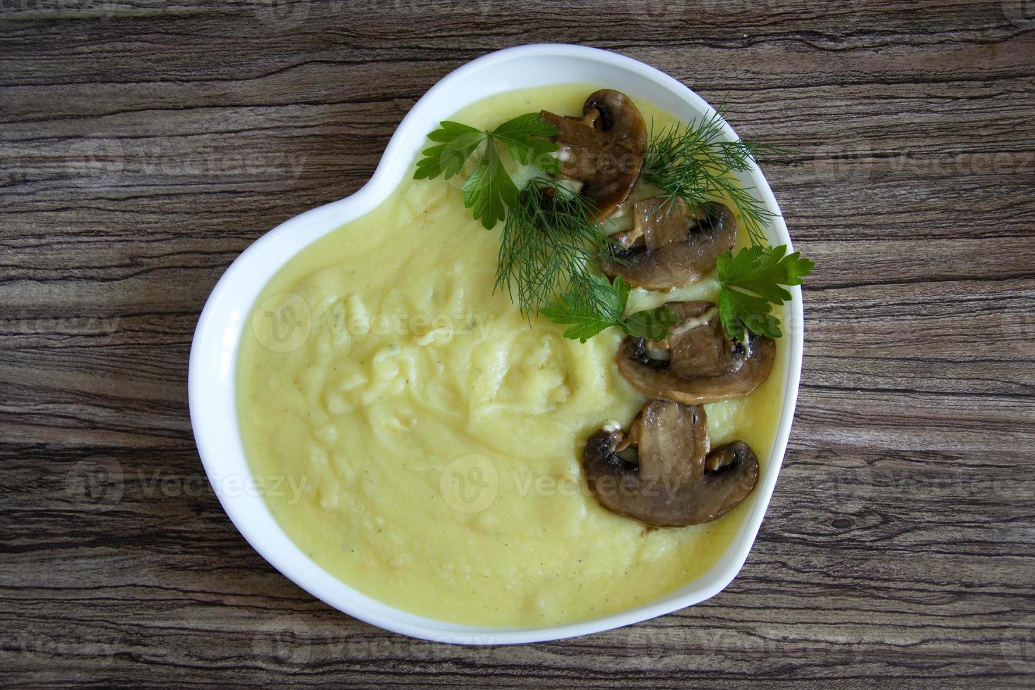 Mashed potatoes. A garnish of champignon mushrooms with mashed photo