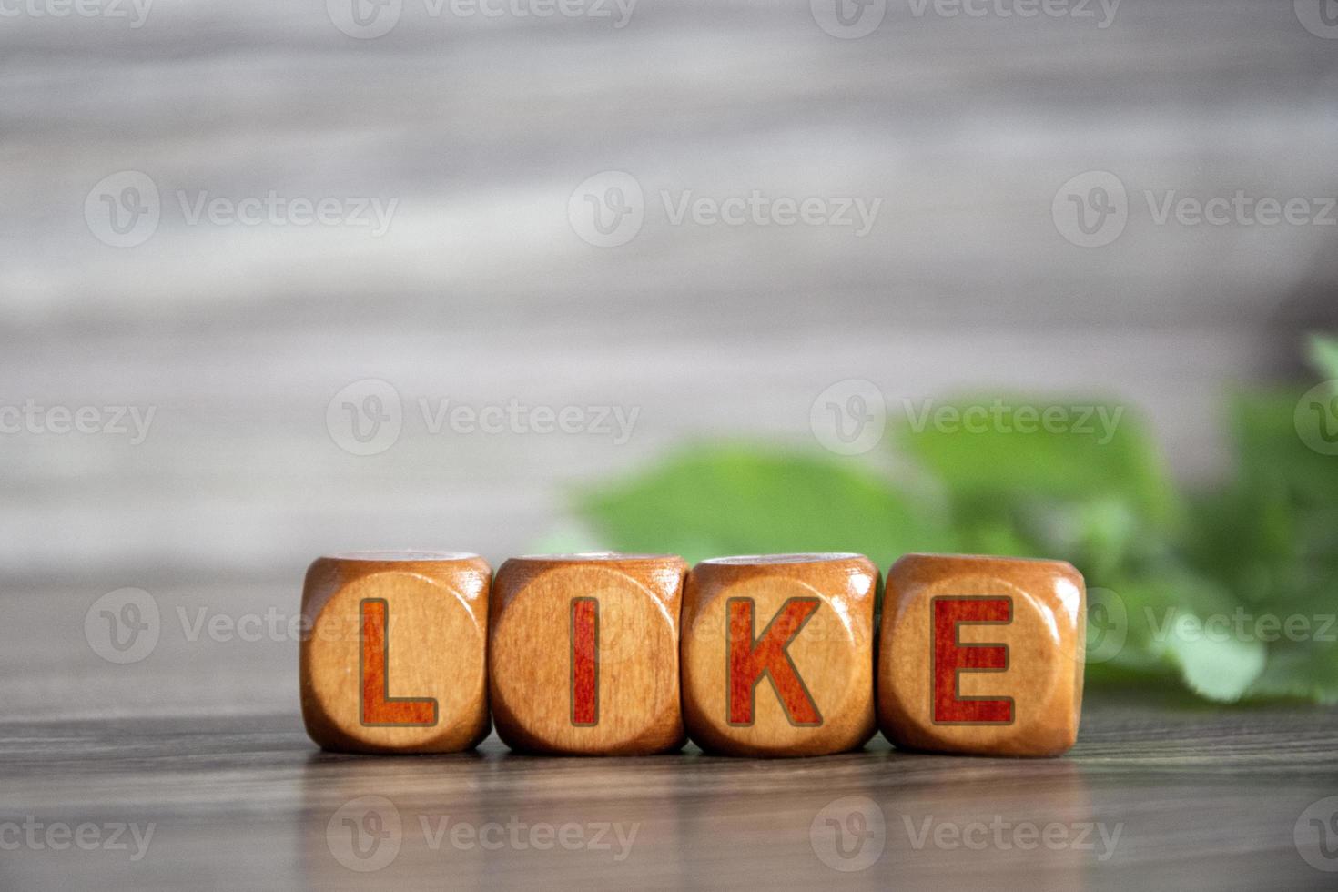 Like. The word like is written on wooden cubes photo