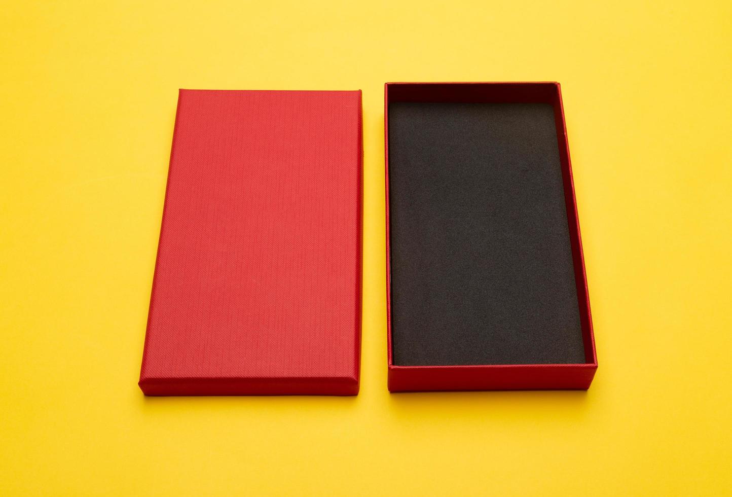 Red box isolated on yellow background photo