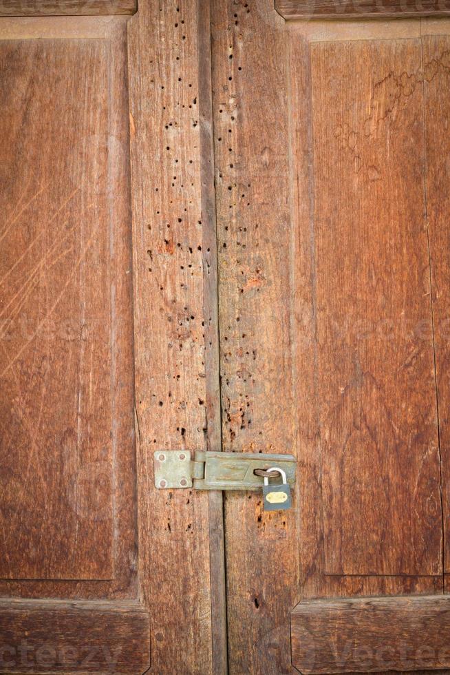 vintage wood door of thai style house photo