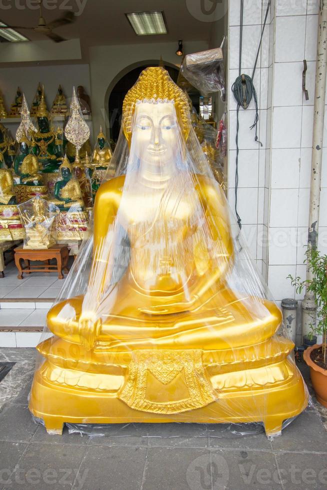 buddha wrapped in plastic photo
