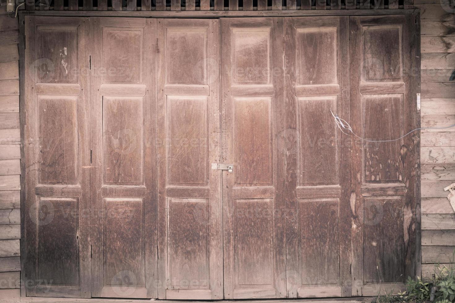 vintage wood door of thai style house photo