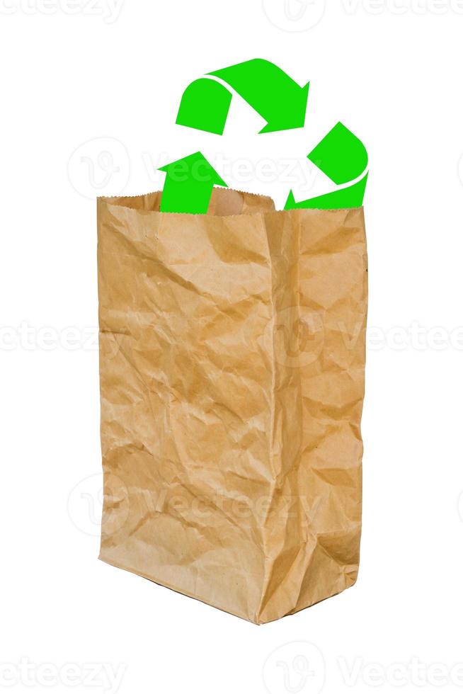 rumpled brown paper bag opened with green recycle sign photo