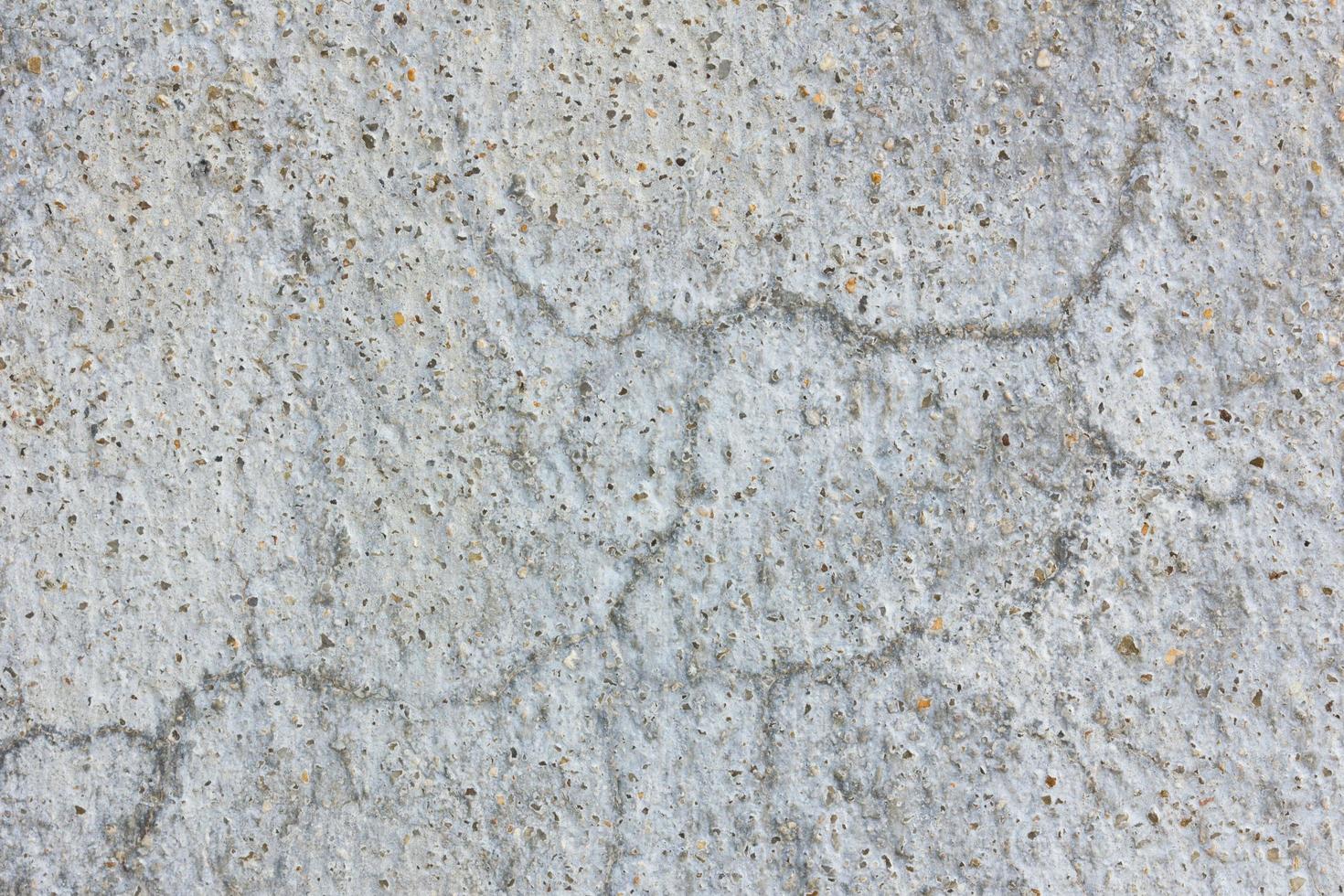 Old worn and cracked asphalt with cracks photo