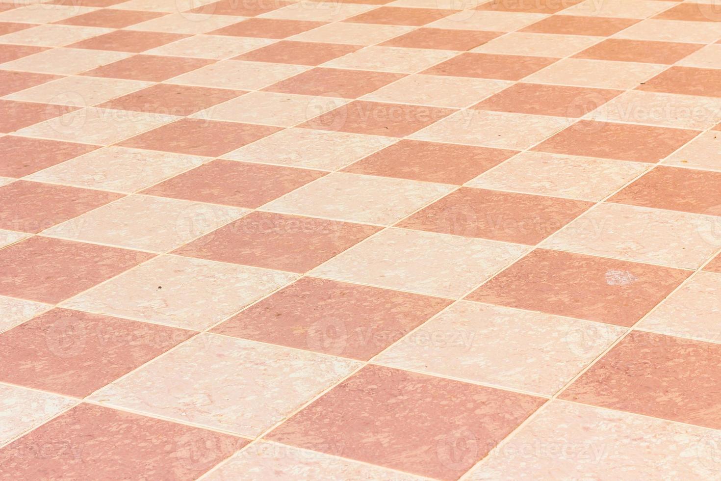 old and pale ceramic tiled floor of temple in thailand, outdoor. photo