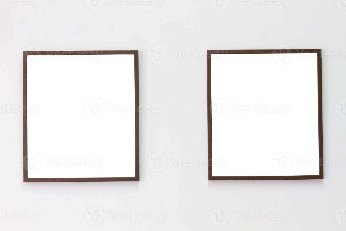 horizontal photo of two photo frame on blank wall background