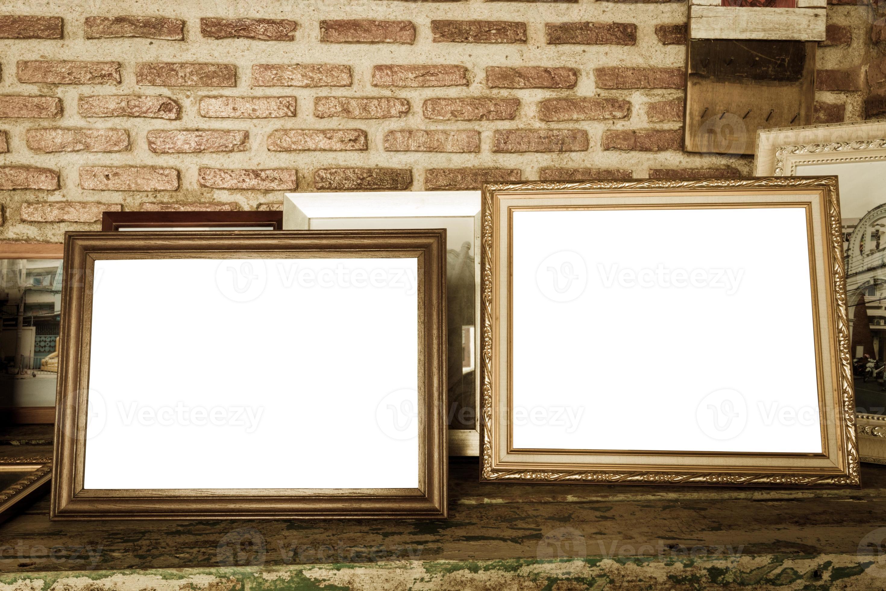 old photo frames on the wooden table 3089035 Stock Photo at Vecteezy