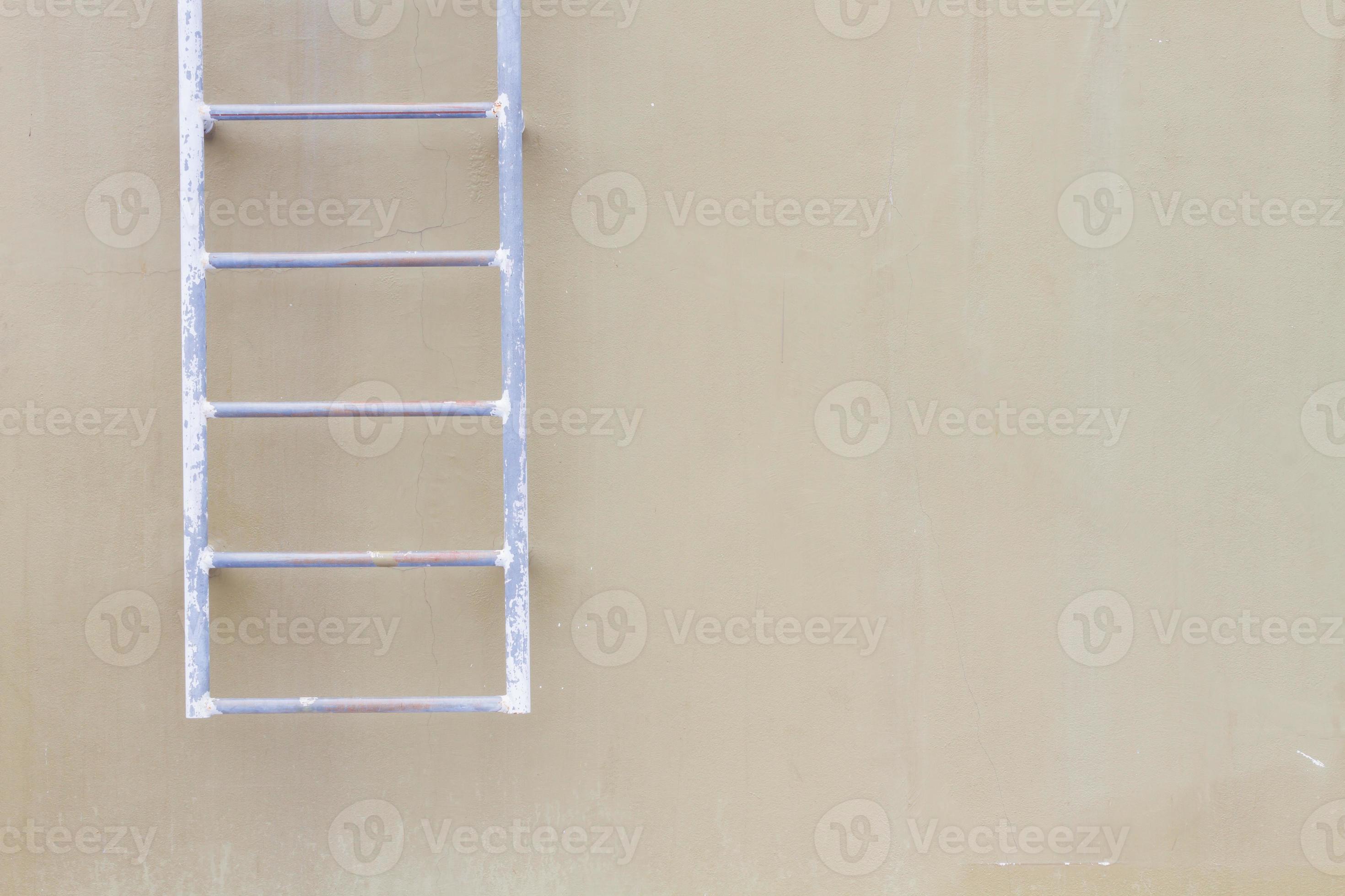 horizontal photo of blank wall background with old hanging ladder