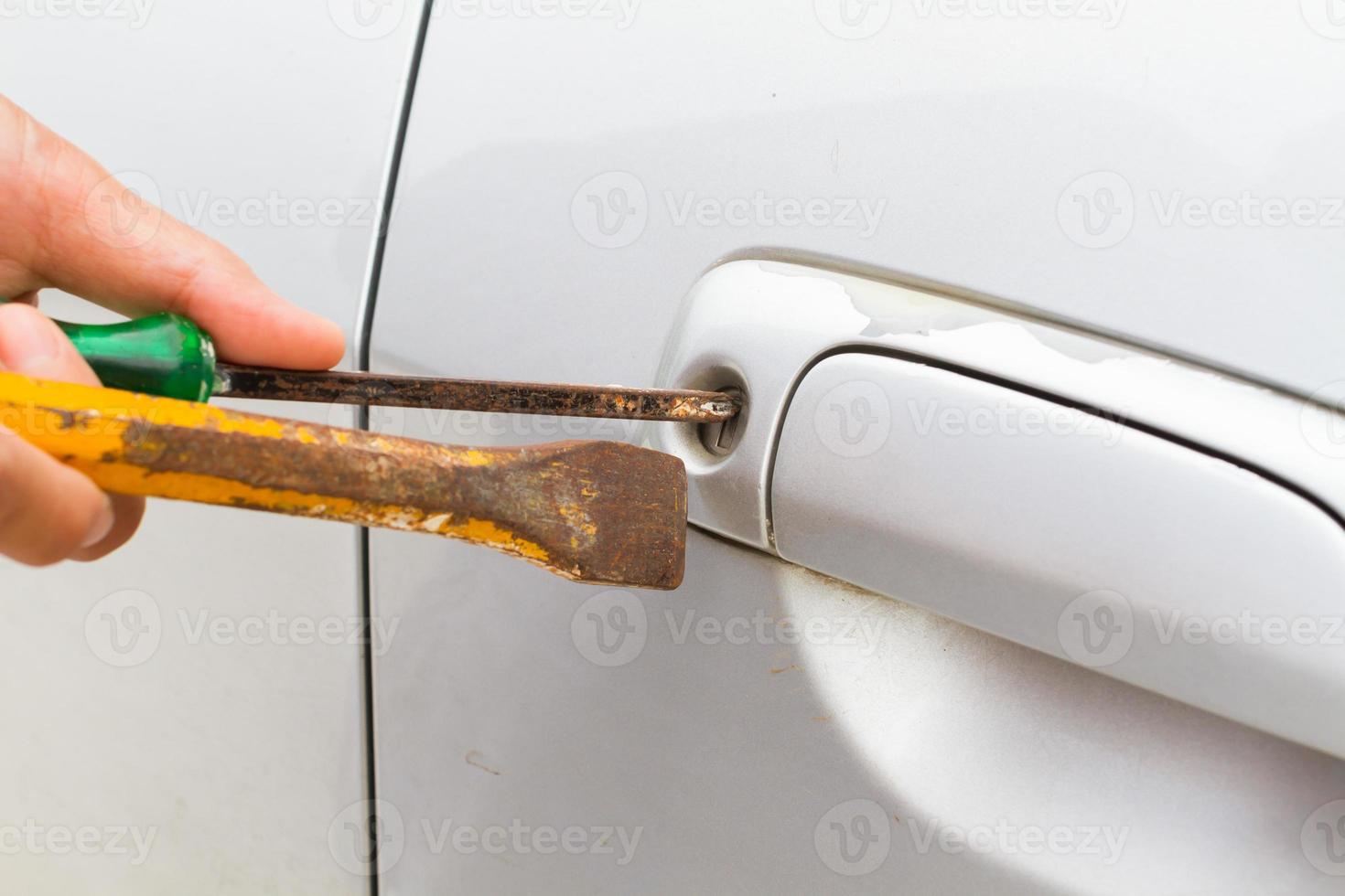 horizontal photo of closeup locksmith will open bronze car