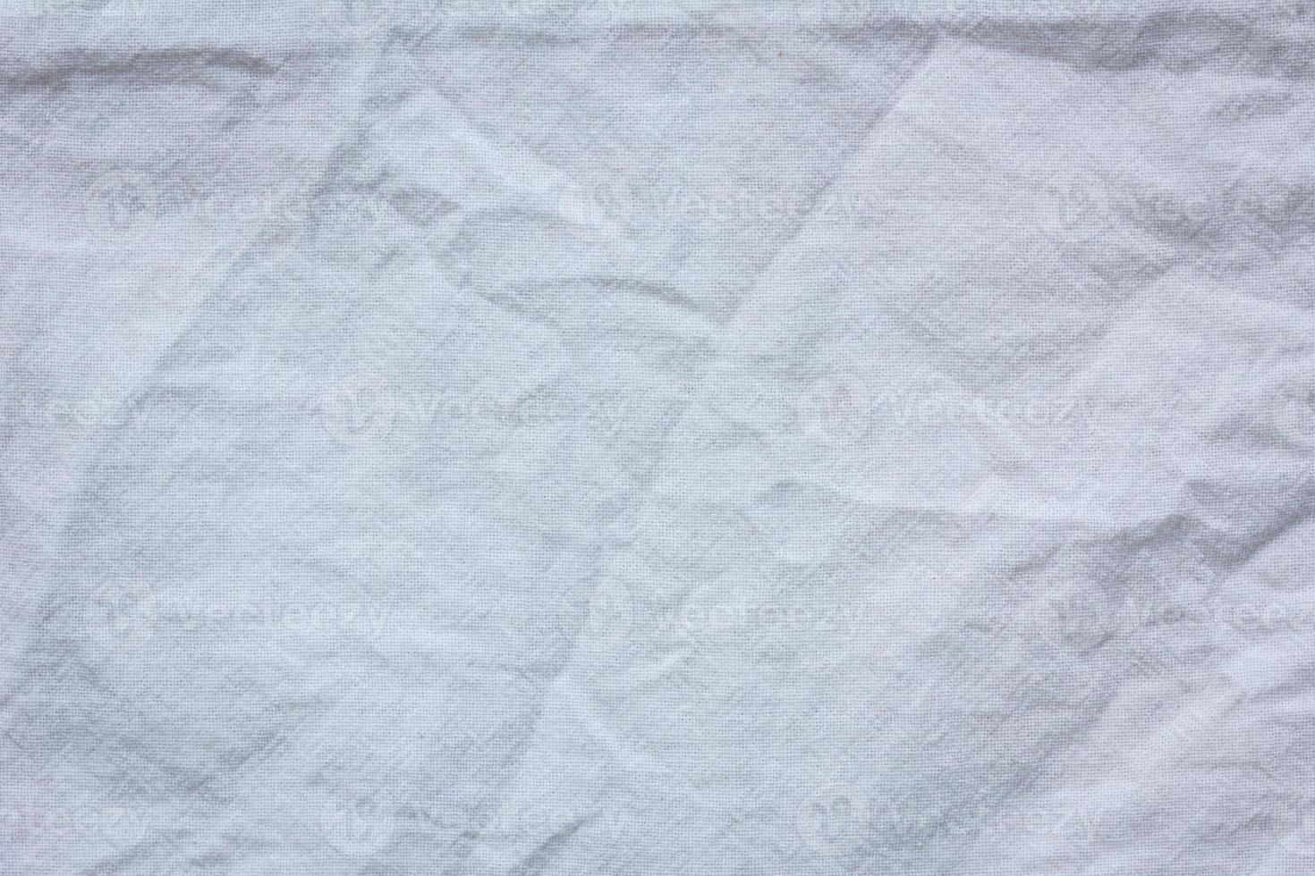 Fondo de textura de textiles de tela arrugada blanca foto
